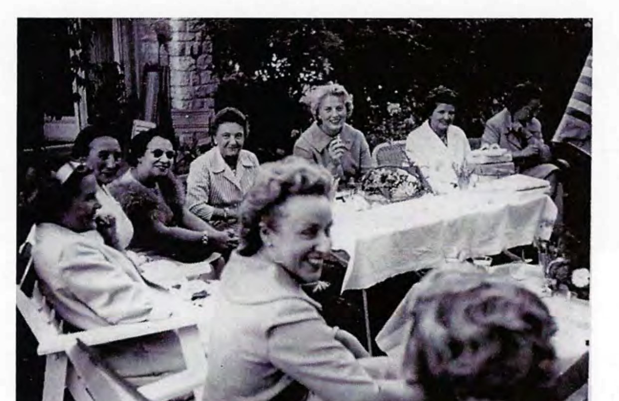 Guests gathered at the farewell party in the garden, 1959