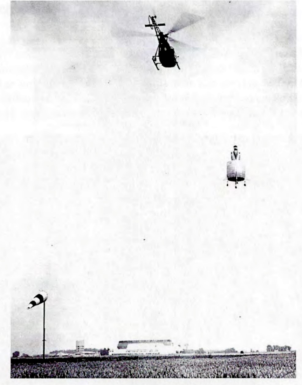 The Coléoptère C&nbsp;450 in free flight, escorted by two observation helicopters over Melun-Villaroche airfield